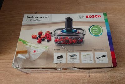 packaging of a box of food on a table with a bunch of berries in it