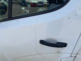 a white car with a black door handle and a window