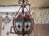 a chandelier hanging from the ceiling in a living room