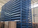 pallet racking in a warehouse with pallets stacked on top of each other