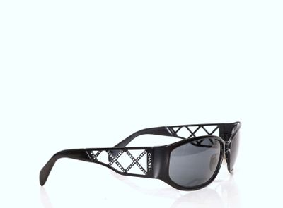 black and white sunglasses on a white background with reflection