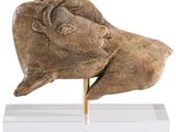 statue of a head of a man with a goat ' s head on a stand
