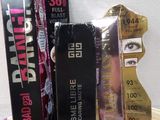 three boxes of makeup products sitting on a table next to each other