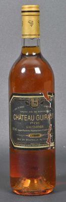 bottle of chateau au gurn whisky sitting on a table