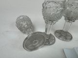 three wine glasses sitting on a table next to each other