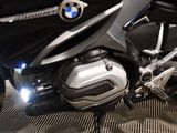 a motorcycle that is parked on the floor in the room