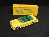 yellow and green toy car with box on black surface