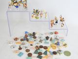 a lot of small figurines sitting on a table