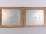 two mirrors that are sitting on a white surface