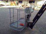 an image of a small lift truck parked in a parking lot
