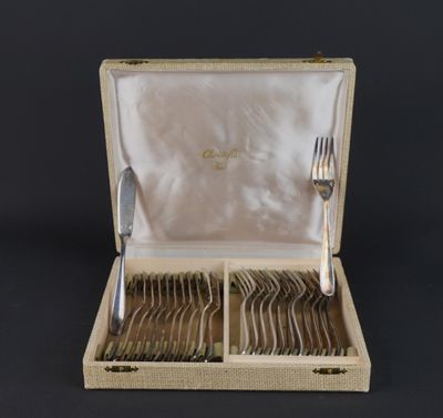 a box with silverware in it on a black surface