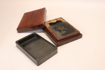 three small wooden boxes with a picture in them on a white surface