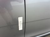 a close up of a car door with a sticker on it