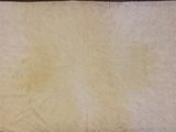 a white towel that is on a brown table