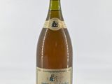 a bottle of wine that is sitting on a table