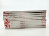 four books stacked on top of each other on a white surface