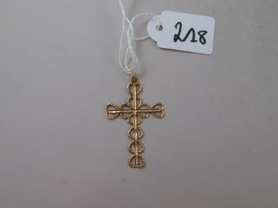 gold plated cross on a white string with a price tag