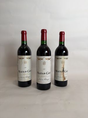 three bottles of wine sitting on top of a table next to each other