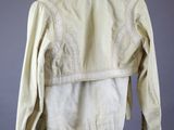 the back of a white jacket hanging on a hanger