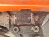 a close up view of the front end of an orange motorcycle