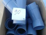 a box full of blue plastic pipes with a price tag on it