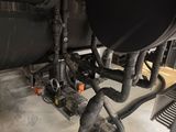 a close up view of a black tank and pipes