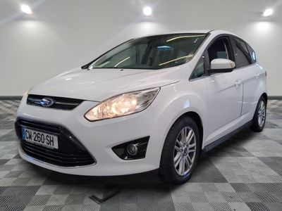 the white ford c - max is parked on a checkered floor