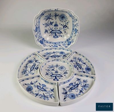 une image représentant une assiette bleue et blanche ornée d'un motif floral