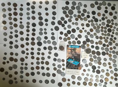 a picture of a refrigerator covered in coins and magnets