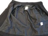 black skirt with black trims and a tag on the bottom of the skirt