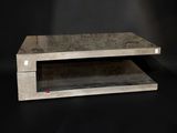 an image of a concrete coffee table on a black background