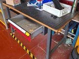a workbench with a lot of tools on it