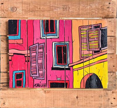 painting of a colorful building on a wooden pallet on a wall