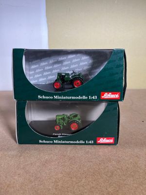 a box with a toy tractor in it sitting on a table