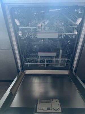 a dishwasher in the middle of a kitchen
