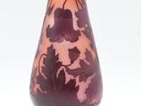 a purple vase with a floral design on it