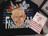 a black t - shirt with a picture of a man ' s face on it