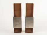 pair of silver and copper bookends on a white background