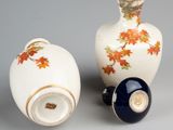 two vases that are sitting next to each other on a table