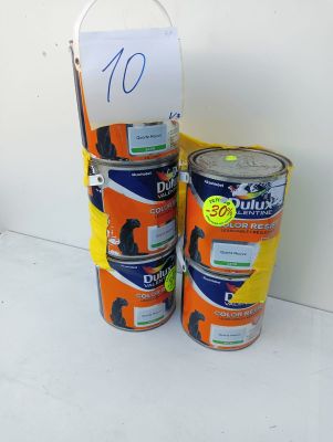 two cans of paint sitting next to each other on a table