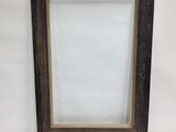 an empty picture frame on a white surface with a white background