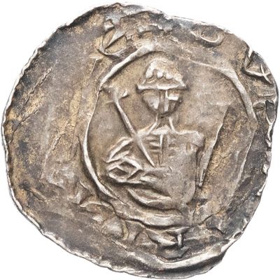 gros plan d'une pièce de monnaie sur laquelle figure un homme
