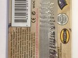 a package of scissors on a table with a barcode on it