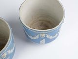 two cups that are sitting next to each other on a table