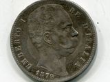 une vieille pièce de monnaie sur laquelle est représenté le visage d'un homme