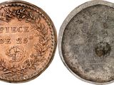 a close up of a coin on a white surface