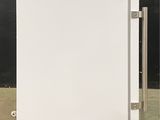 an image of a white refrigerator in a room