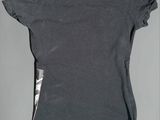 grey top with ruffles on the shoulders