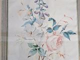 a picture of a painting of flowers on the wall
