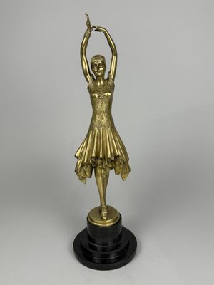 an image of a statue of a woman holding a tennis racquet